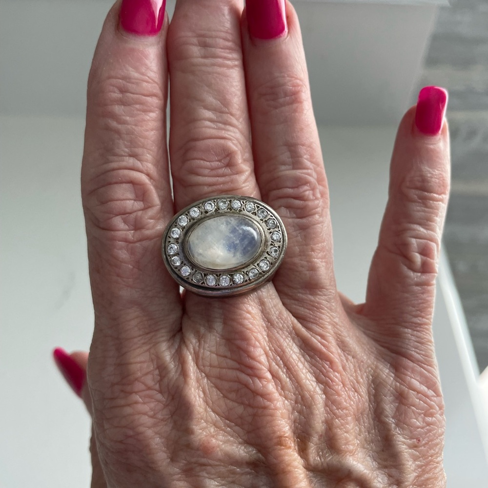 Striking Silver Moonstone Ring with Halo Design